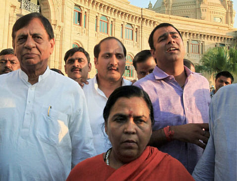 BJP leader Uma Bharti holding a protest with party MLAs against whom arrest warrants were issued by a court in connection with the Muzaffarnagar riots, at the Vidhan Sabha in Lucknow on Wednesday. PTI Photo