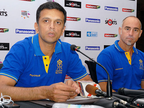 Rajasthan Royals captain Rahul Dravid with coach Paddy Upton addressing a press conference ahead of their match at Champions League Twenty 20 2013 in Jaipur on Thursday. PTI Photo