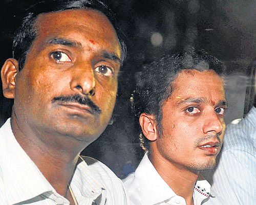 Kampli MLA Suresh Babu (right) is taken to the Bowring Hospital for a medical check-up by the CBI officers in Bangalore on Thursday. DH PHOTO