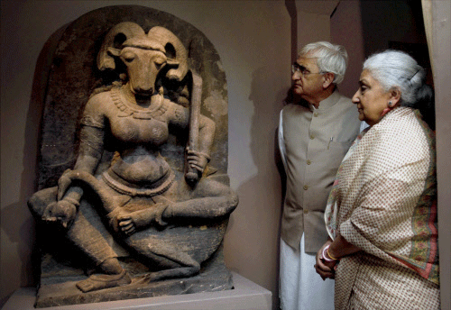 External Affairs Minister Salman Khurshid and Union Culture Minister, Chandresh Kumari Katoch looking at the ancient sculpture of Yogini Vrishanana on display at the exhibition 'Return of the Yogini' at National Museum in New Delhi on Thrusday. The sculpture which was taken to France illegally, was acquired by the National Museum in the month of Aug 2013. PTI Photo