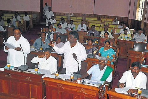 Zilla Panchayat member Huchchegowda makes a point at the general meeting, in Mandya, on Thursday. dh photo