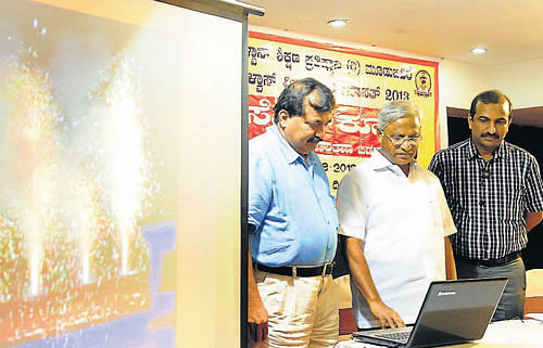 preparing for celebrations: MLA&#8200;J&#8200;R&#8200;Lobo launches the website as Alva's Education Foundation Chairman Dr M Mohan Alva looks on. (Right) The logo. DH photos
