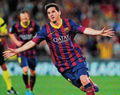 unstoppable: Barcelona's Lionel Messi celebrates after scoring against Ajax Amsterdam at the Camp Nou on Wednesday.