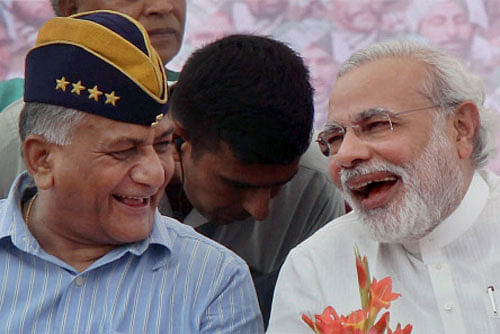 BJP's Prime Ministerial candidate for the 2014 elections and Gujarat Chief Minister Narendra Modi with retired Army chief V K Singh during the Ex-sevicemen rally in Rewari, Haryana on Sunday. PTI Photo