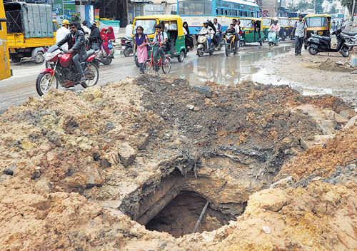 nightmarish ride: The road dug up to carry out work on sewage line four days ago was not repaired even on Friday. dh photo