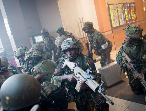 Armed police leave after entering the Westgate Mall in Nairobi, Kenya Saturday, Sept. 21, 2013. Gunmen threw grenades and opened fire Saturday, killing at least 22 people in an attack targeting non-Muslims at an upscale mall in Kenya's capital that was hosting a children's day event, a Red Cross official and witnesses said. AP Photo