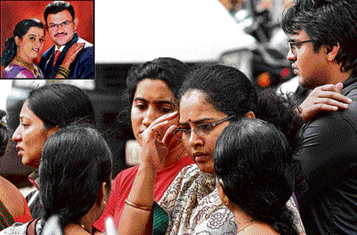 Relatives and friends mourn Madhusudhan and Roopa (inset) in the City on Saturday. DH Photo