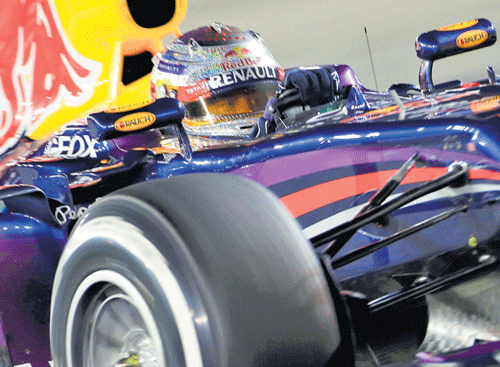 Sebastian Vettel en route winning the Singapore Grand Prix at the Marina Bay circuit on Sunday. REUTERS