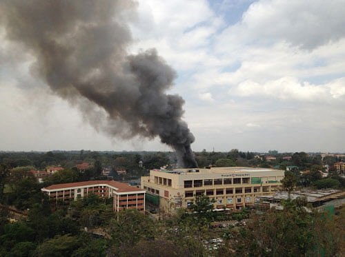 Heavy smoke rises from the Westgate Mall in Nairobi Kenya Monday Sept. 23 2013. Multiple large blasts have rocked the mall where a hostage siege is in its third day. Associated Press reporters on the scene heard multiple blasts and a barrage of gunfire. Security forces have been attempting to rescue an unknown number of hostages inside the mall held by al-Qaida-linked terrorists. AP Photo