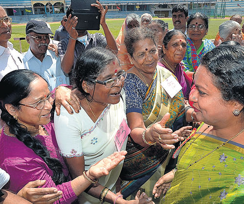 age no bar: Women and Child Development Minister Umashree interacts with participants at the sports meet for senior citizens organised to mark 'World Elders' Day-2013', in Bangalore on Monday.  dh photo