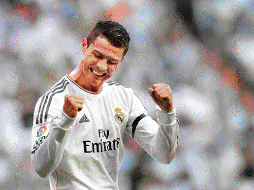 Yesss! Cristiano Ronaldo celebrates after scoring against Getafe in the La Liga on Sunday.