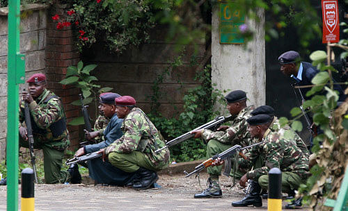 Police officers take position during the ongoing military operation at the Westgate Shopping Centre in Nairobi Reuters