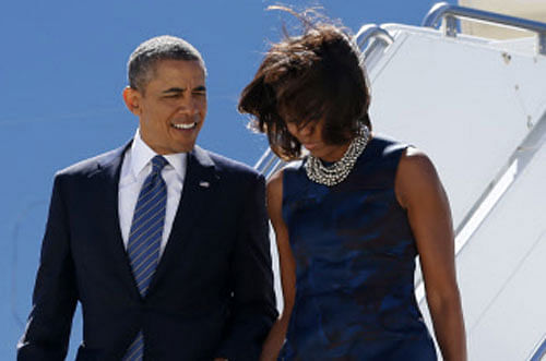 U.S. President Obama and the first lady walk down from Air Force One upon their arrival in New York Reuters Image