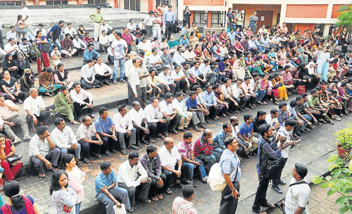 A large number of parents gathered in front of the school in Manipal on Monday. DH photo