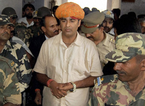 BJP MLA Sangeet Som, accused of allegedly circulating a hate video that allegedly led to the recent riots, being produced in a court in Muzaffarnagar on Saturday. PTI Photo
