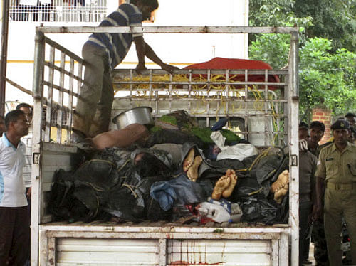 Bodies of Maoist rebels lie stacked in the back of a truck as they are brought to a hospital for postmortem in Malkangiri, in the eastern Indian state of Orissa, Saturday, Sept. 14, 2013. At least 13 Maoist rebels were killed during a gunbattle with security personnel in a forest area in Malkangiri district, according to news reports. (AP Photo)