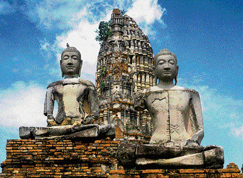 iconic Buddha statues at Wat Chawattanaram, Ayutthaya in Thailand.