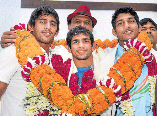 young champs Wrestlers Bajrang (left), Amit Kumar (centre) and Sandeep Yadav during a felicitation function. PTI