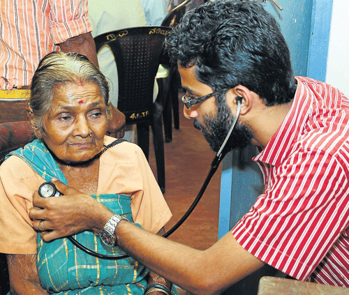 A doctor examines the villagers at a free health check up camp organised by Indian Red Cross Society (DK unit) in                 association with district administration and Jana Shikshana Trust at Banjarumale in Belthangady on Wednesday.