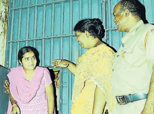 Horale Saroja comes out of the jail in Mangalore on Wednesday night. DH photo