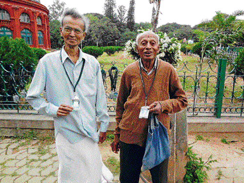 happy Senior citizens pose with their identity cards.