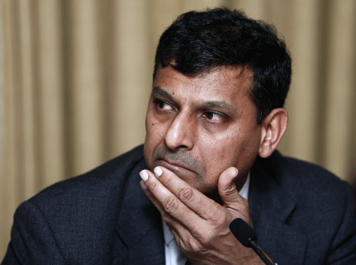 File photo of Reserve Bank of India Governor Rajan listening to a question during a news conference in Mumbai. Reuters