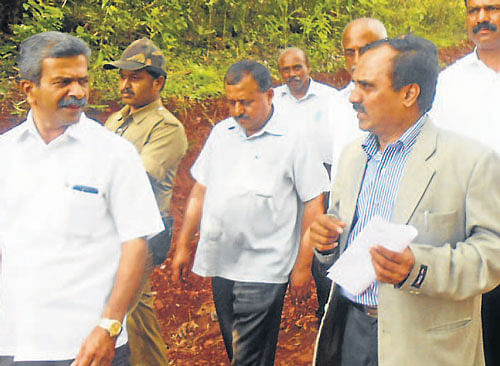 A Central team inspects the damaged road at Guddethota in Koppa taluk. dh photo