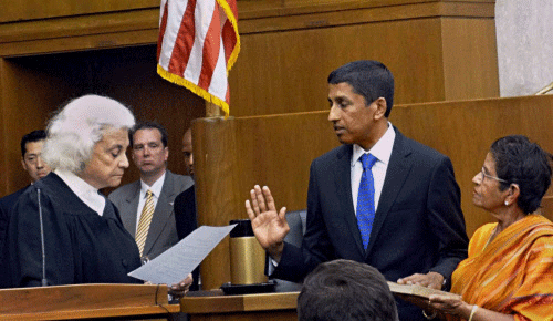 Judge Sri Srinivasan taking the oath of office in Washington on Thursday. Indian American Srinivasan is the first South Asian to be appointed to the United States Circuit Judge of the United States Court of Appeals for the District of Columbia Circuit, which is considered as the second highest court in the US after the Supreme Court. PTI Photo