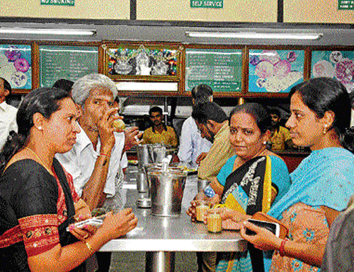 relishing Customers at the eatery. DH PHOTOS BY DINESH SK
