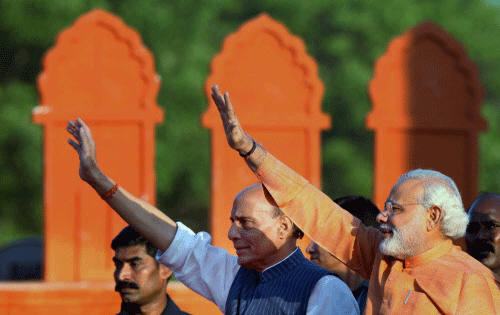 BJP President Rajnath Singh and party's Prime Ministerial candidate Narendra Modi during the party's Yuva Kamal Conference in Tiruchirappalli on Thursday. PTI Photo