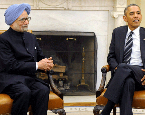 Prime Minister Manmohan Singh talks with US President Barack Obama during their media statements in White House in Washington on Friday. PTI Photo