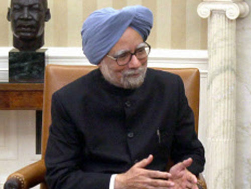 Prime Minister Manmohan Singh talks with US President Barack Obama during their media statements in White House in Washington on Friday. PTI Photo