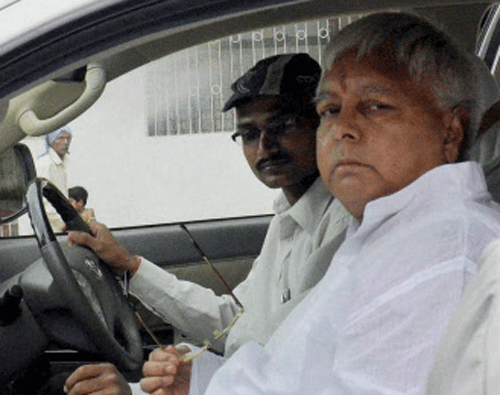 RJD chief Lalu Prasad Yadav leaves for Ranchi to appear before a CBI court in connection with fodder scam in Patna on Sunday. PTI Photo