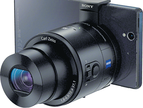 Sony's new QX100 camera connects wirelessly to a cellphone and features manual controls, optical image stabilisation, a tripod mount and a Zeiss f/1.8 lens. NYT