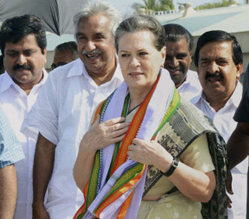 PA Chairperson Sonia Gandhi being received by Kerala Chief Minister Oommen Chandy on her arrival at the airport in Thiruvananthapuram on Sunday. PTI Photo