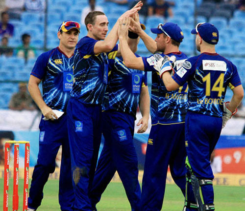 Otago Volts players celebrate wicket of a Highveld Lions batsman during the CLT20 match in Jaipur on Sunday.PTI Photo