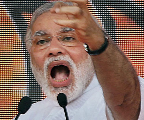 BJP Prime Ministerial candidate Narendra Modi speaks at party Vikas Rally in New Delhi on Sunday.PTI Photo