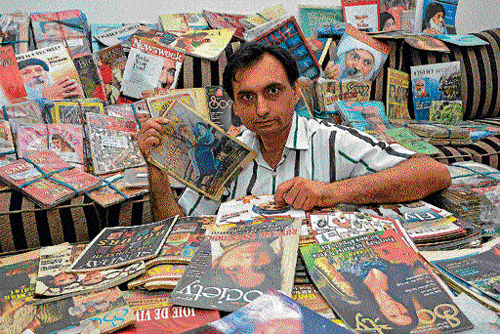 Aggregator: Kamal Jit Singh surrounded by the magazines which he has been collecting since the age of 10.