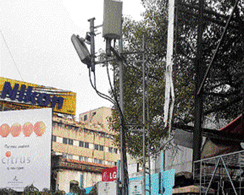 A telecom tower on a footpath on MG Road. DH photo