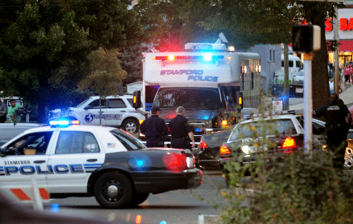 Law enforcement from local, state and federal jurisdictions investigate the residence of Miriam Carey in Stamford, Conn. Thursday, Oct. 3, 2013. Law-enforcement authorities have identified Carey, 34, as the woman who, with a 1-year-old child in her car, led Secret Service and police on a harrowing chase in Washington from the White House past the Capitol Thursday, attempting to penetrate the security barriers at both national landmarks before she was shot to death, police said. The child survived. AP photo
