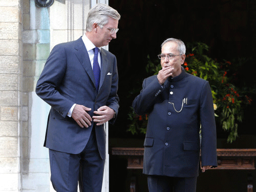 India's President Shri Pranab Mukherjee (R) is welcomed by Belgium's King Philippe (L) at the Brussels Royal Palace October 4, 2013. REUTERS