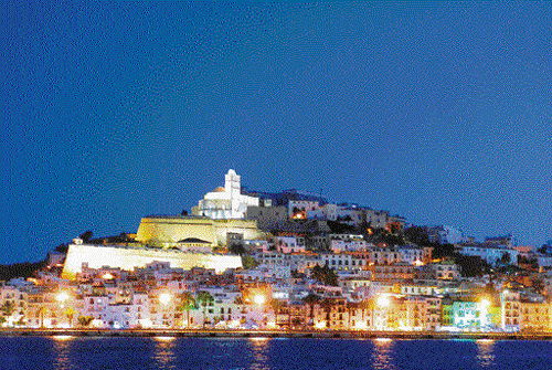 Colours of Ibiza The old city shimmers in the night;.photos by author