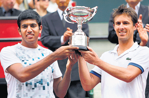 over the moon: Rohan Bopanna (left) and Frenchman Edouard Roger-Vasselin with their doubles spoils . reuters