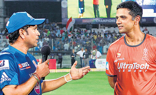 Mumbai Indians' Sachin Tendulkar and Rajasthan Royals' Rahul Dravid discuss a point before the CLT20 final in New Delhi on Sunday. Photo by BCCI