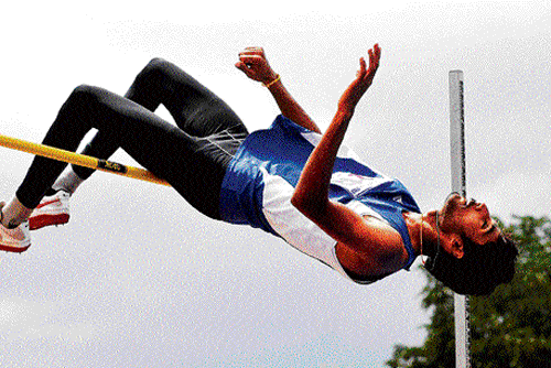 good show: Bangalore City's Chetan B sets a meet record in the men's high jump event. dh photo/ prashanth hg