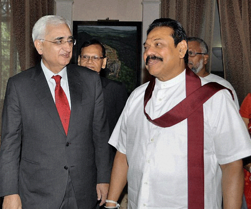 External Affairs Minister Salman Khurshid with Sri Lankan President Mahinda Rajapaksa at a meeting in Colombo on Tuesday. PTI Photo