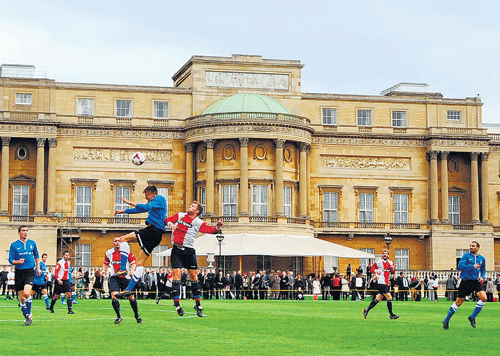 heady venue: A football match in progress at the Buckingham Palace to mark the 150th    anniversary of the Football Association in London on Monday. Reuters