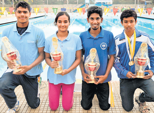 CHAMPIONS ALL: (From left) Arvind M and Damini K Gowda, winners of the best  swimmers titles along with G Vaibhav and Abhijeet Gaonkar, best diver awardees. DH PHOTO