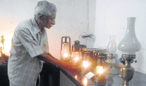 Lamp collector M S Padmanabha with his collection at Kalamandir in Mysore.