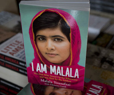 Copies of a newly published book about Pakistani girl Malala Yousafzai are on display at a local bookshop in Islamabad, Pakistan, Tuesday, Oct. 8, 2013. In 2012, Malala was a 15-year-old schoolgirl in northwest Pakistan, thinking about calculus and chemistry, Justin Bieber songs and 'Twilight' movies. Today she's the world-famous survivor of a Taliban assassination attempt, an activist for girls' education and a contender to win the Nobel Peace Prize on Friday. AP Photo/